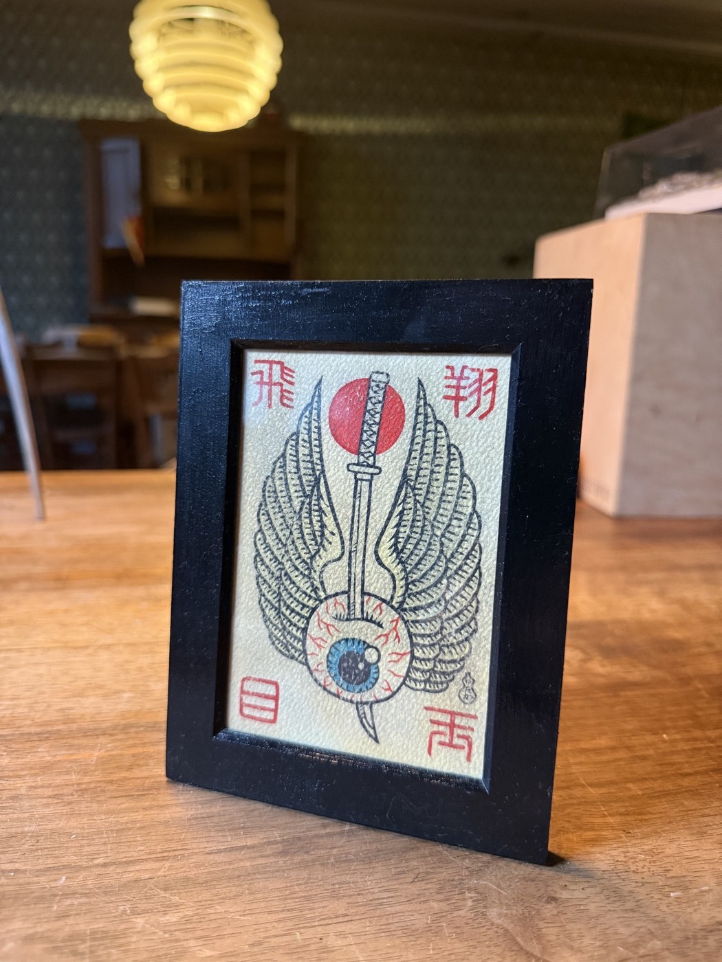 Gerahmtes Bild «Flying Eyeball» mit Kanji